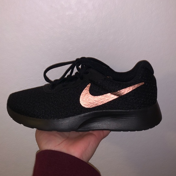 black nike with gold check